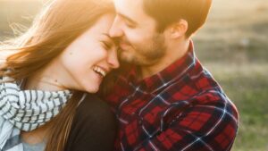 Couple smiling hugging happily